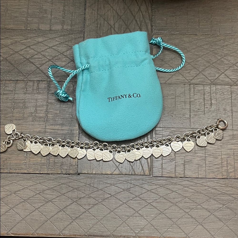 Tiffany & Co. Silver Heart Charm Bracelet with Blue Pouch. Barely worn.